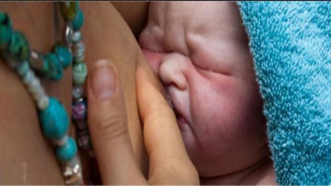 Perouze is given breast milk shortly after her incredible birth. Picture: Real Life Story Agency