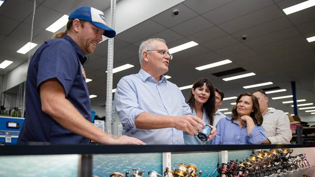 PM ties and tests his knot. Prime Minister Scott Morrison visits BCF in the electorate of Robertson, in West Gosford to shop fishing supplies, run-through fishing equipment demonstrations and announce that a re-elected Coalition Government will invest $20 million in a Recreational Fishing and Camping Facilities Program. Picture: Jason Edwards