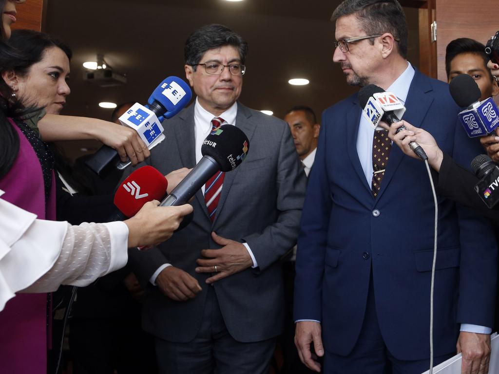 Ecuadorean Foreign Affairs Minister Jose Valencia (left) and Ecuadorean Attorney-General Inigo Salvador speak to the media after the hearing. Picture: Cristina Vega/AFP
