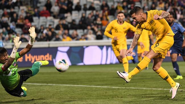 Socceroos striker Jamie Maclaren scores his third goal and Australia’s fifth against Nepal in their World Cup qualifier at GIO Stadium in Canberra. Picture: AAP