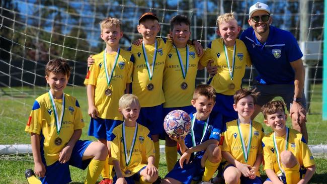 Kawana Football Club under 9s with coach Dylan Fennell.