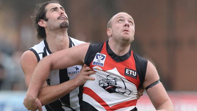 Russell Gabriel, pictured playing for the Frankston Dolphins in 2014, competes against Collingwood ruckman Brodie Grundy in the VFL.