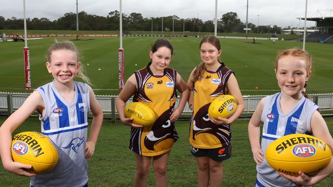 Millie Spencer, 9, from the Blue Mountains Kangaroos, Piper and Mackenzie Lillia, 10, from Baulkham Hills Hawks and Abby Croucher, 9, from the Blue Mountains Kangaroos at Blacktown International Sportspark., Pic: AAP\Robert Pozo.