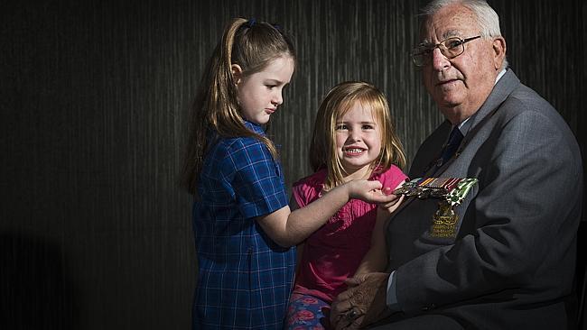 Kingsgrove RSL subbranch secretary and Vietnam War veteran John Graham with granddaughters Mali (3) and Siena (5) Stevens / Picture: Chris McKeen