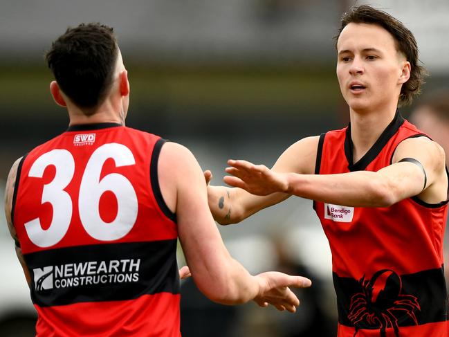 Nathan Rayment of Romsey is congratulated by team mates after kicking a goal during the round 16 Riddell District Football Netball League 2023 Bendigo Bank Seniors match between Romsey and Macedon at Romsey Park in Romsey, Victoria on August 5, 2023. (Photo by Josh Chadwick)