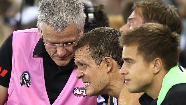 Collingwood’s Luke Ball shows the strain as he takes a quick rest.