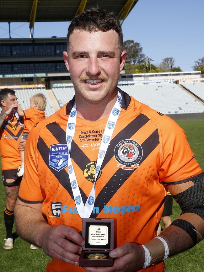 Emu Plains signing Cameron Williams with the man of the match award after last season’s Macarthur reserve grade grand final. Picture: John Appleyard