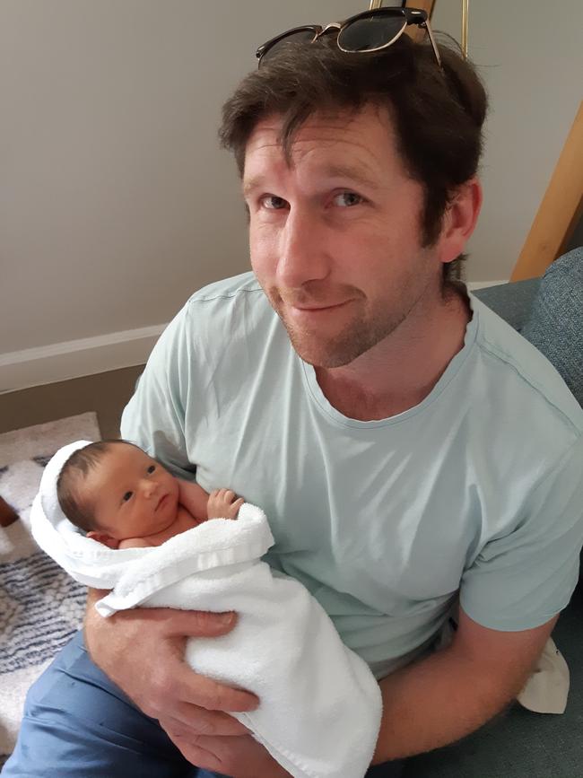 Rob D'Arcy with surrogate baby Till Barnett. Picture: Supplied.