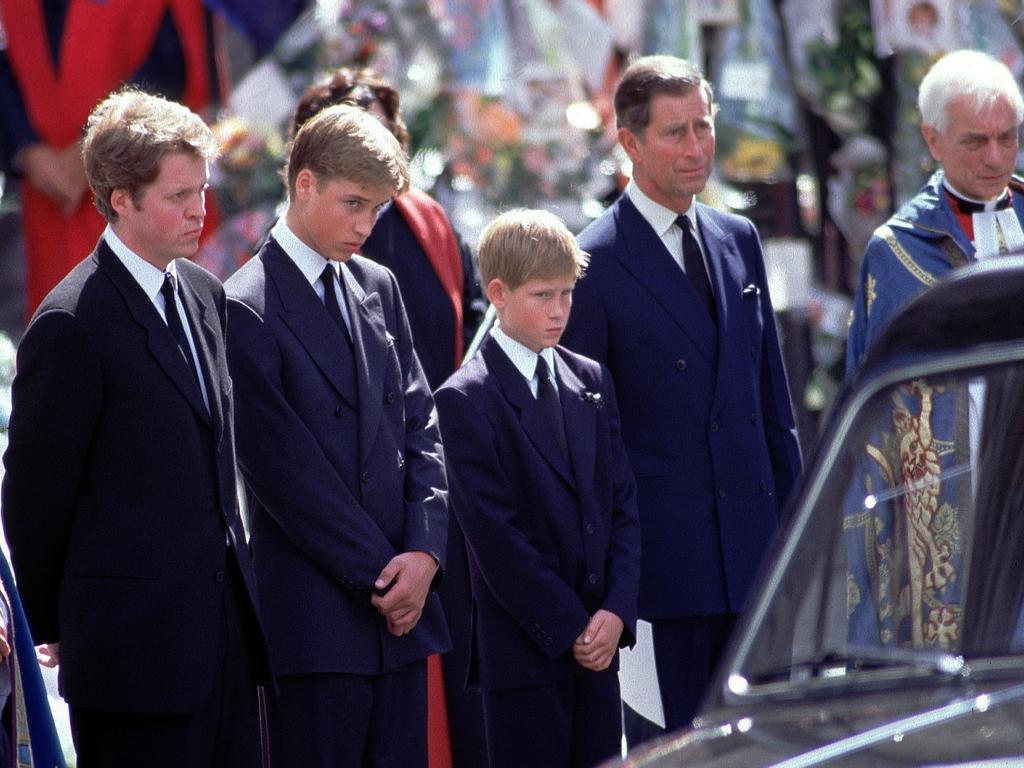 L-R: Earl Spencer Prince Charles Prince William Harry and Prince Charles stand alongside the hearse containing the coffin of Diana after the funeral service at Westminster Abbey. Picture: Jeff Overs