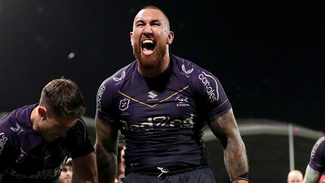 MELBOURNE, AUSTRALIA - SEPTEMBER 15: Nelson Asofa-Solomona of the Storm celebrates the try of Will Warbrick of the Storm during the NRL Semi Final match between Melbourne Storm and the Sydney Roosters at AAMI Park on September 15, 2023 in Melbourne, Australia. (Photo by Kelly Defina/Getty Images)