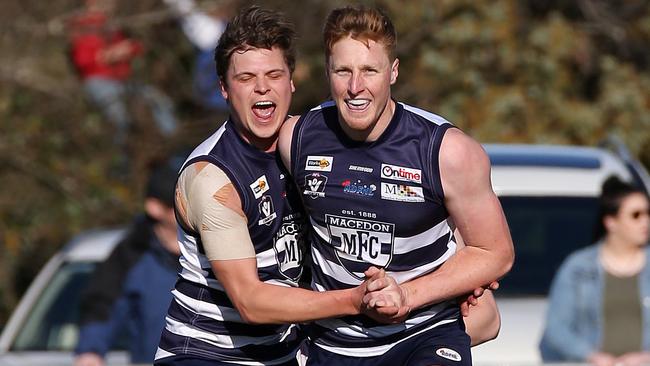 Macedon's Matt Dick (right) celebrates a goal. Picture: George Salpigtidis