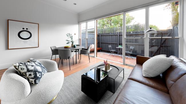 Glass doors and windows look out to the rear courtyard.