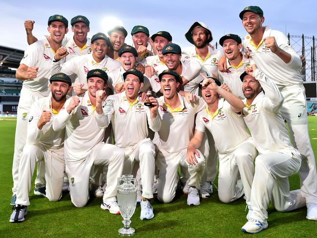 Australia's captain Tim Paine holds the Ashes Urn as the players celebrate victory after the presentation ceremony on the fourth day of the fifth Ashes cricket Test match between England and Australia at The Oval in London on September 15, 2019. - England won the fifth test by 135 runs and drew the series but Australia keeps The Ashes trophy. (Photo by Glyn KIRK / AFP) / RESTRICTED TO EDITORIAL USE. NO ASSOCIATION WITH DIRECT COMPETITOR OF SPONSOR, PARTNER, OR SUPPLIER OF THE ECB