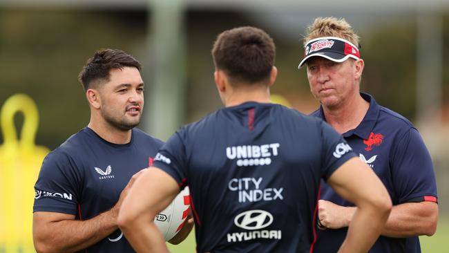 Brandon Smith talks to Roosters head coach Trent Robinson during a Sydney Roosters NRL training session. Getty