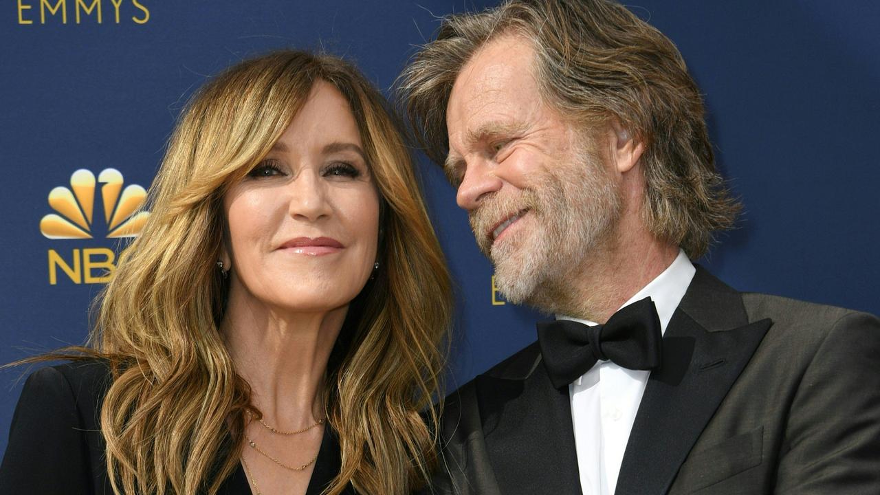 Felicity Huffman with husband William H Macy, who escaped charges over the scandal. Picture: AFP