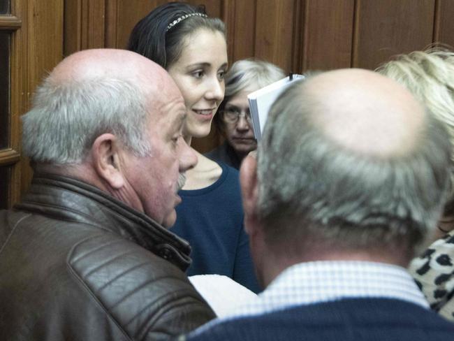 Danielle Janse van Rensburg (C), the girlfriend of convicted killer Henri van Breda (unseen).  Picture:  AFP