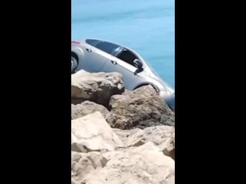 Bystanders shocked after pensioner nearly drives off cliff