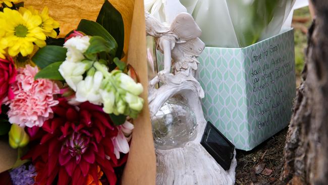 Flowers, postcards with heartfelt memories and ornaments were placed at the scene. Picture: NCA Newswire /Gaye Gerard