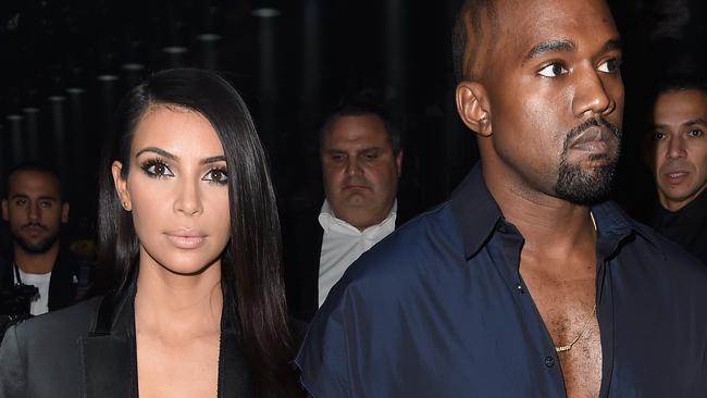 PARIS, FRANCE - SEPTEMBER 25: (L-R) Kim Kardashian and Kanye West attend the Lanvin show as part of the Paris Fashion Week Womenswear Spring/Summer 2015 on September 25, 2014 in Paris, France. (Photo by Pascal Le Segretain/Getty Images)