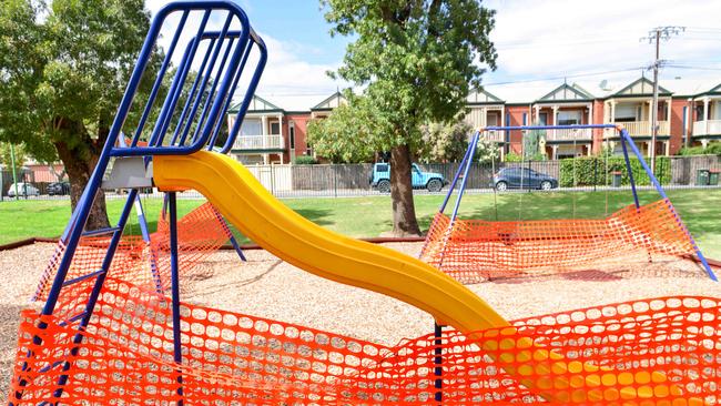 Playspaces across Adelaide, including the Twelftree Reserve playground in College Park, are being sealed off from the public. Picture: AAP/Brenton Edwards.