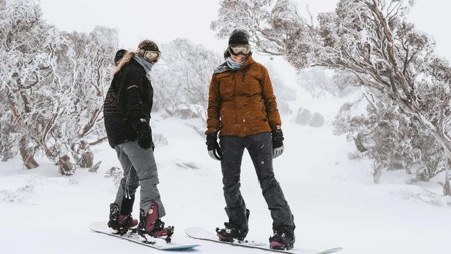 With Sydney locked down, snowboarders Siobhan Anton, 22, and Ellie McMaster, 19, from Newcastle, have the Perisher slopesall to themselves. Picture: Jamila Toderas