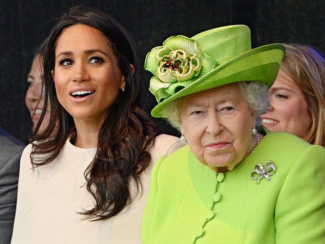 (FILE PIC)  Britain's Queen Elizabeth II and Meghan, Duchess of Sussex attend the opening of the Mersey Gateway Bridge, the new six lane toll bridge over the River Mersey in Halton, Cheshire on June 14, 2018. (Photo by Jim Clarke / POOL / AFP)