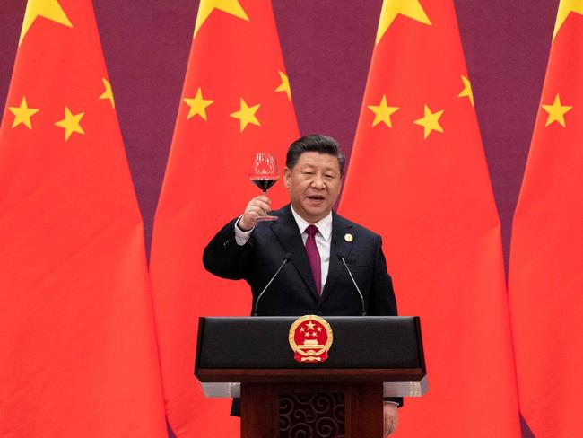 (FILES) In this file photo China's President Xi Jinping raises his glass and proposes a toast at the end of his speech during the welcome banquet for leaders attending the Belt and Road Forum at the Great Hall of the People in Beijing on April 26, 2019. - The global infrastructure plan announced by G7 leaders aims to offer developing nations a credible alternative to China's much-criticized Belt and Road Initiative -- but it faces major hurdles on the ground, especially if Beijing's hiccups are any indication.  US President Joe Biden was able to convince the G7 to sign onto the initiative, drawing allies into Washington's strategic rivalry with Beijing, under a plan titled "Build Back Better World" (B3W) that aims to provide hundreds of billions in infrastructure investment to developing nations. (Photo by Nicolas ASFOURI and NICOLAS ASFOURI / POOL / AFP)