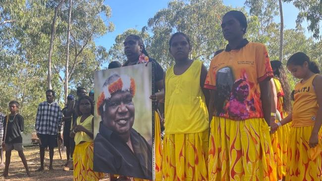 Gumatj clan members hold a photo of late tribal leader Yunupingu at the opening ceremony of the 2023 Garma Festival. Picture: Zizi Averill