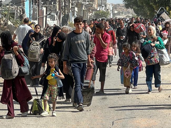 Displaced families fleeing Israeli army operations in Jabalya in northern Gaza take the main Salah al-Din road towards Gaza City. Picture: AFP