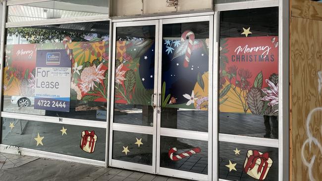 A wrecked roof, graffitied walls, and damaged tiles at the former Dimmeys Arcade greets visitors to the Townsville CBD. Picture: Leighton Smith.