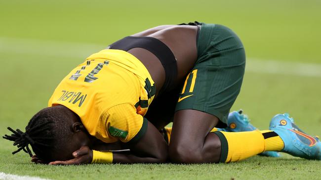 Awer Mabil reacts following his side’s victory in the 2022 FIFA World Cup Playoff match. Picture: Mohamed Farag/Getty Images