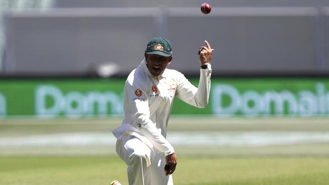 Usman Khawaja casually tosses the ball away after his stunning catch to dismiss Virat Kohli. Picture: AP