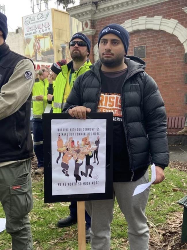 A worker at the protest with a sign.