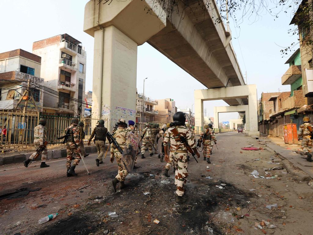 Security personnel patrol an area following clashes between supporters and opponents of a new citizenship law in New Delhi. Picture: AFP