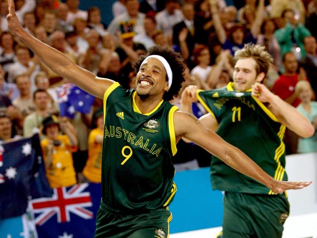 Boomers players CJ Bruton (front) and Mark Worthington celebrate their gold medal win at the 2006 Commonwealth Games.