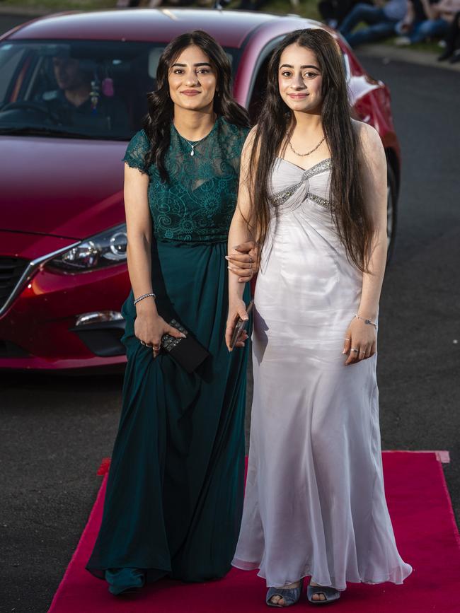 Manisa Izdeen (left) and Nafia Ismael arrive at Harristown State High School formal at Highfields Cultural Centre, Friday, November 18, 2022. Picture: Kevin Farmer