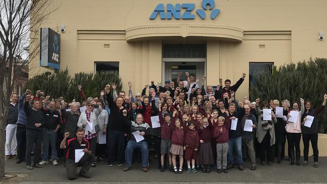 Locals, including Garry Hughes (to the left of the person seated) protesting against ANZ Bank's Lobethal branch closure on September 20, 2018.  Pic Supplied by Garry Hughes.