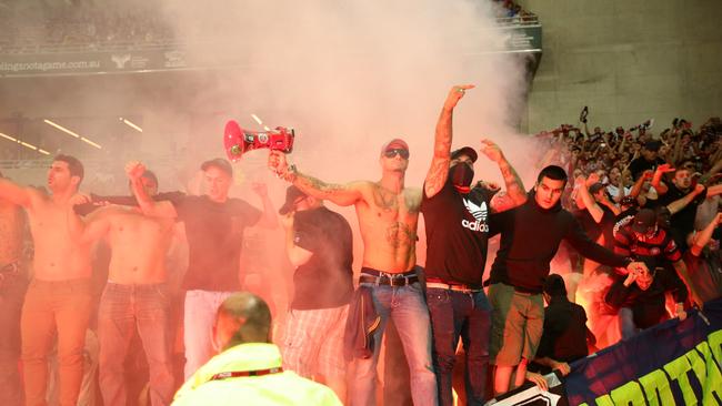 Soccer fans @Melbourne  Victory v Western Sydney Wanderers .Wanderers fans walking towards AAMI Stadium in Melbourne  .