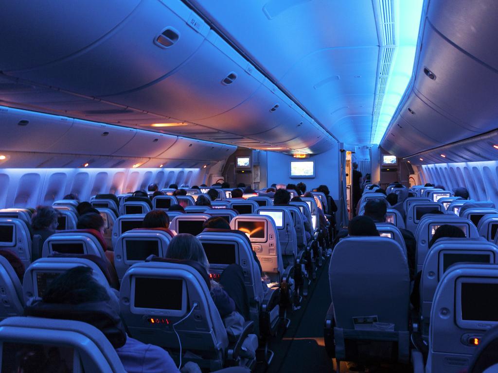 How to sleep on a plane in economy class: 11 tips for flights from ...