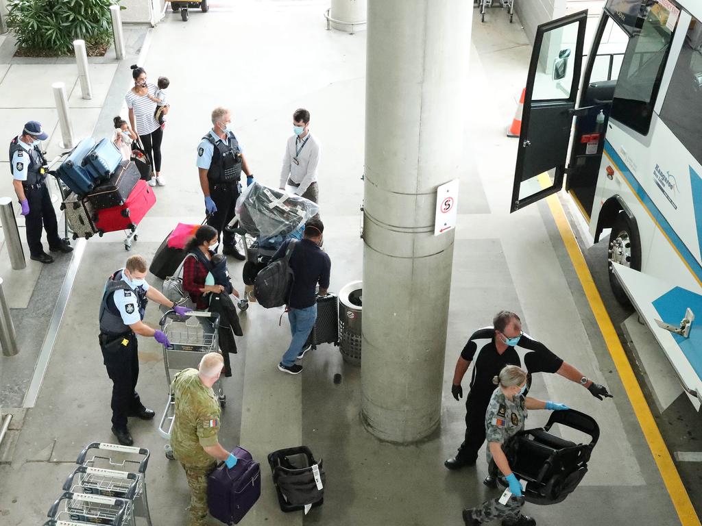 The first flight from New Zealand arrives at the Brisbane International Airport after the QLD Premier lifted mandatory quarantine, all of the passengers were taken to a bus for hotel quarantine. Photographer: Liam Kidston