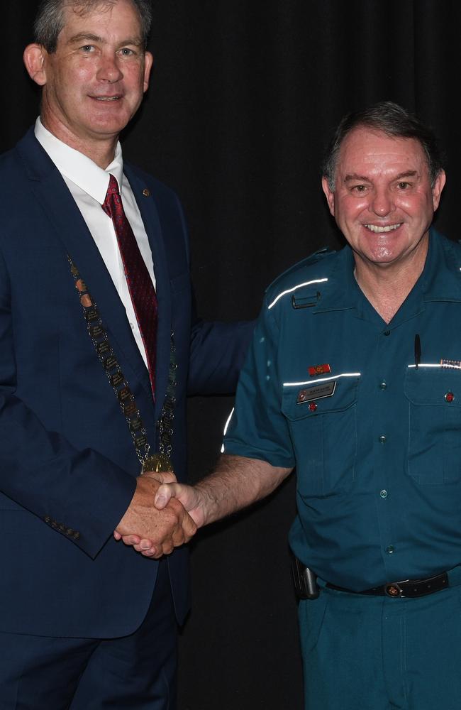 Former Gympie Regional Council Mayor Mick Curran congratulates Wayne Saches at the 2020 Australia Day Awards (Ambulance Service Medal recipient).