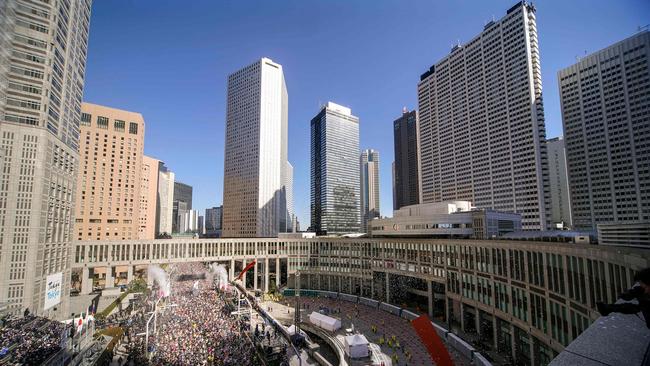 Runners fill the street in front of the Tokyo Metropolitan Government Building at the start of the Tokyo Marathon 2024 in Tokyo.