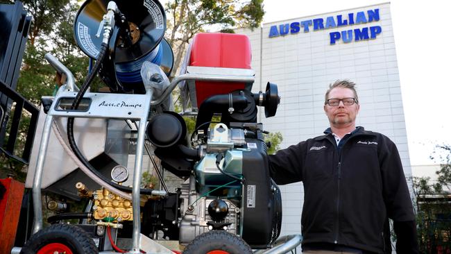 Operations manager Hamish Lorenz with one of the $12,000 machines. Picture: Angelo Velardo