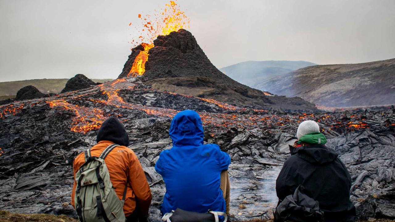 People having been hiking to watch the volcano erupt in Iceland. Picture: Jeremie Richard/AFP