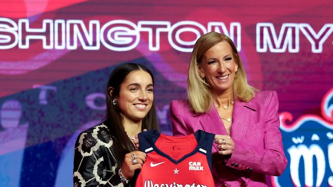 NEW YORK, NEW YORK - APRIL 14: (L-R) Georgia Amoore poses for a photo with WNBA Commissioner Cathy Engelbert after being selected with the sixth overall pick by the Washington Mystics during the 2025 WNBA Draft at The Shed on April 14, 2025 in New York City. NOTE TO USER: User expressly acknowledges and agrees that, by downloading and or using this photograph, User is consenting to the terms and conditions of the Getty Images License Agreement. (Photo by Elsa/Getty Images)