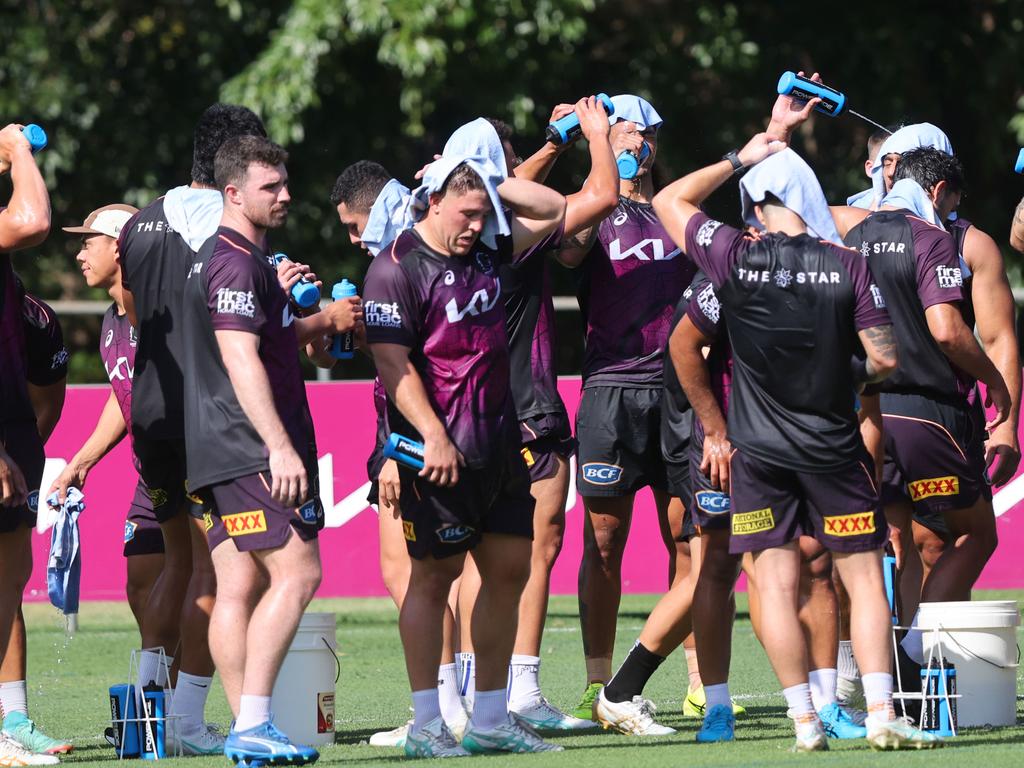 Broncos drenched themselves with water and cooled off with ice towels. Picture: Nigel Hallett