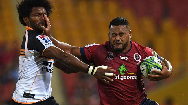 Taniela Tupou of the Reds (right) fends off Henry Speight of the Brumbies during the round three clash.