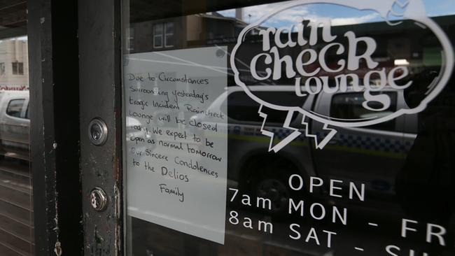 The Rain Check Lounge, which is next door to the North Hobart Grocer, was closed yesterday as a mark of respect. Picture: LUKE BOWDEN