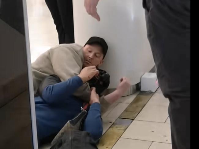 A man is held on the ground in the shopping centre. Picture: Facebook