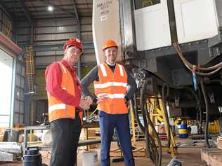 RAIL RALLY: MP Bruce Saunders with transport minister Mark Bailey at Maryborough's Downer factory. Picture: Blake Antrobus